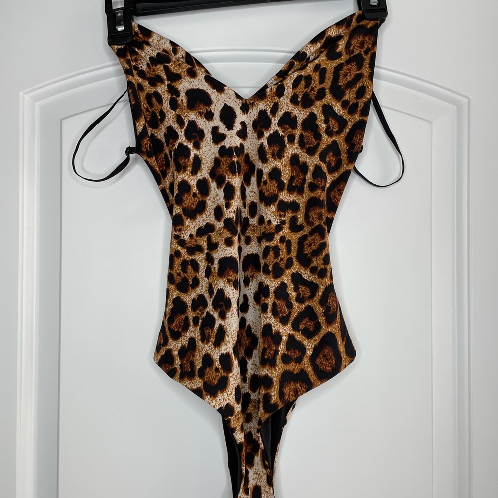 Cheetah bodysuit with an open back. Size small. Great condition.